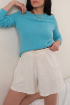 Vintage turquoise cashmere crewneck sweater modeled back view