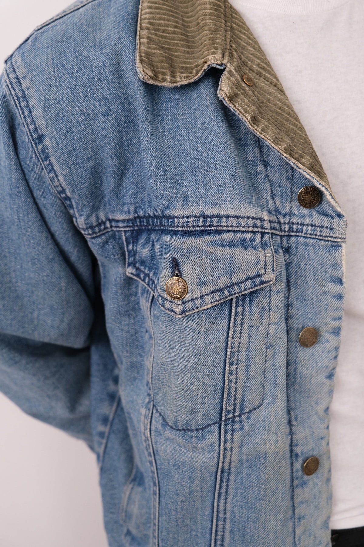 Vintage light wash cotton denim jacket detail